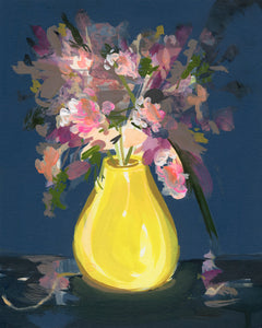 pink and purple flowers in a yellow vase in front of a navy blue background